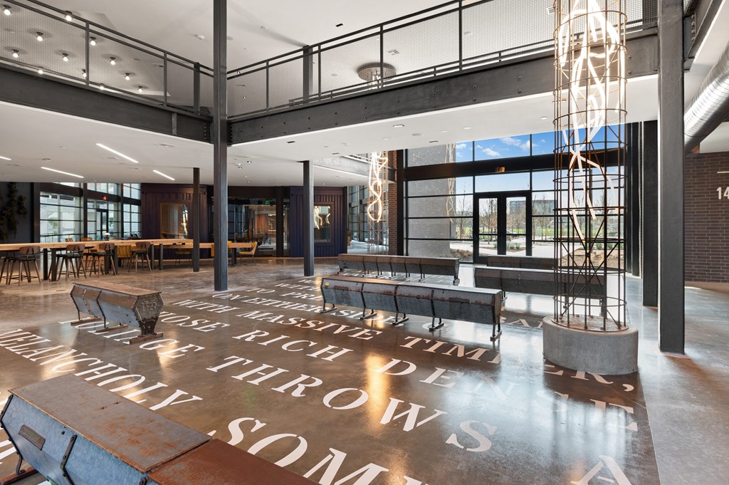 the lobby of a building with a large message on the floor