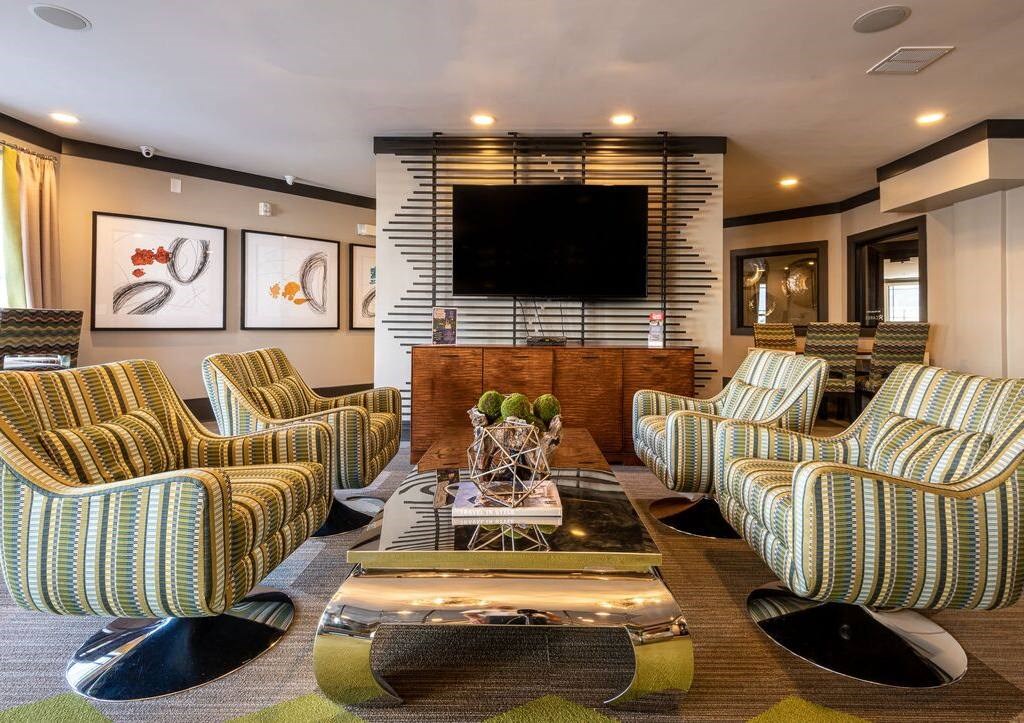 a living room filled with furniture and a television