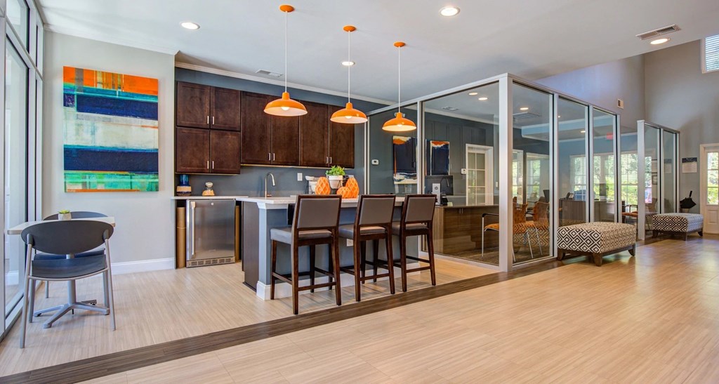 A modern kitchen with a dining table and chairs.