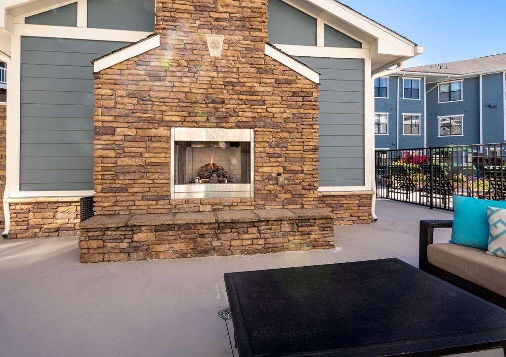 a large brick fireplace on the side of a house