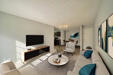 A living room with a grey couch and a coffee table.