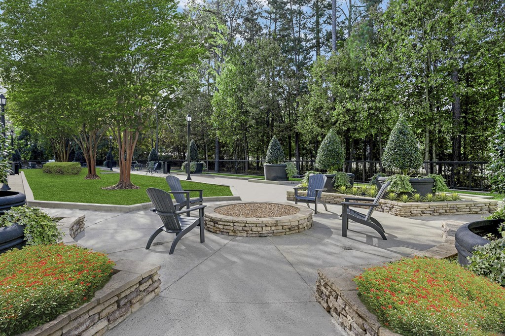 a patio with chairs and a fire pit