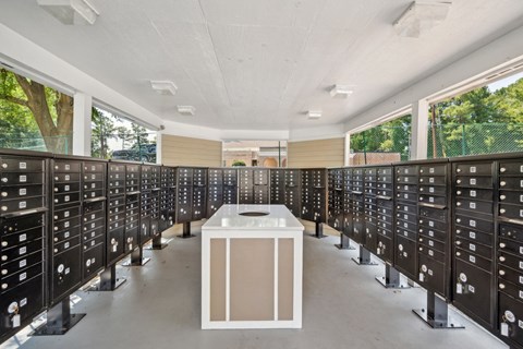 a large room with many lockers and a table in the middle