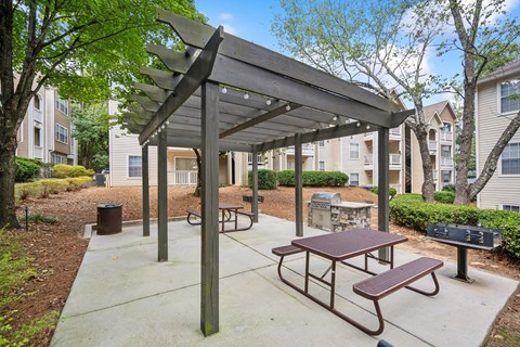 a picnic area with benches and a picnic table