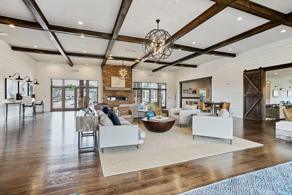 a large living room with furniture and a chandelier