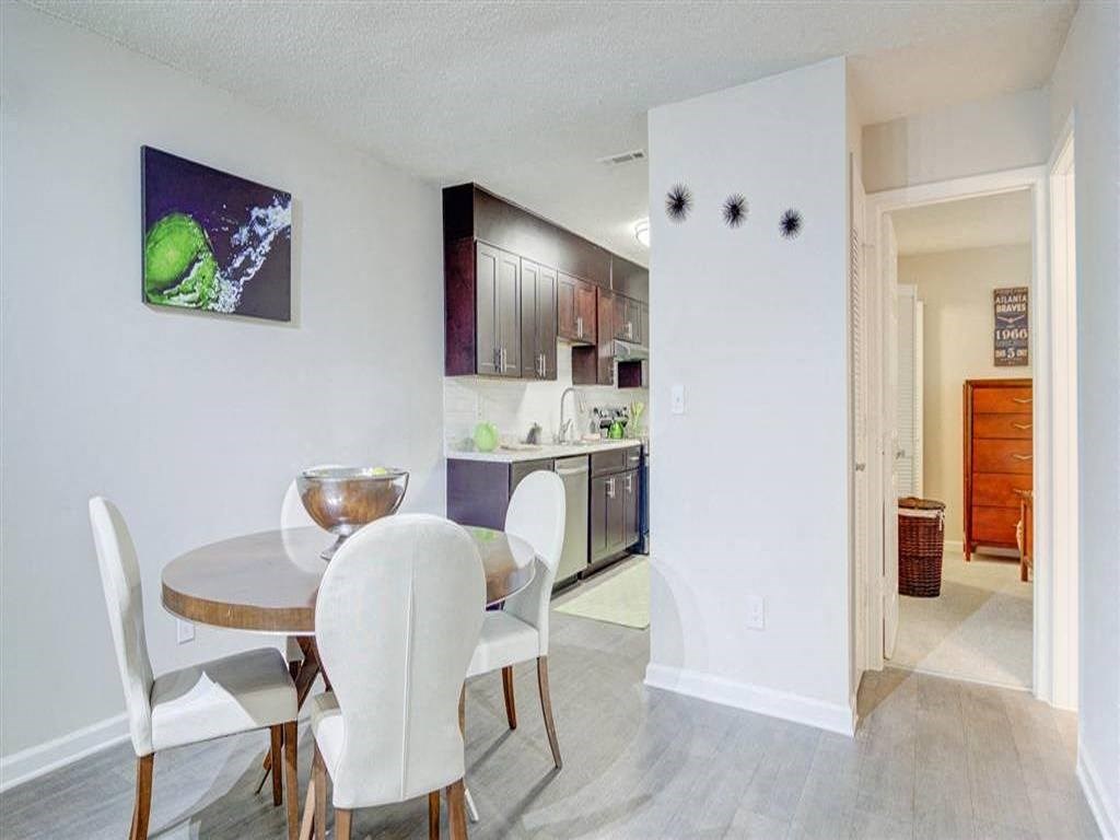 a dining room with a table and chairs