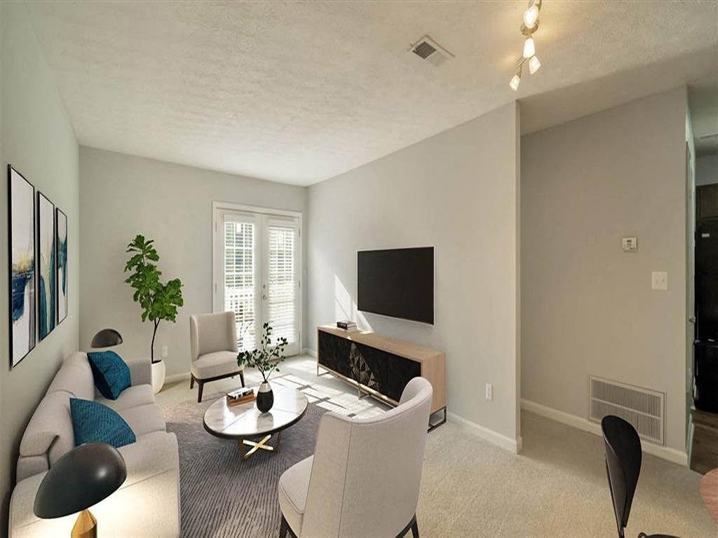 a living room with a couch and a television