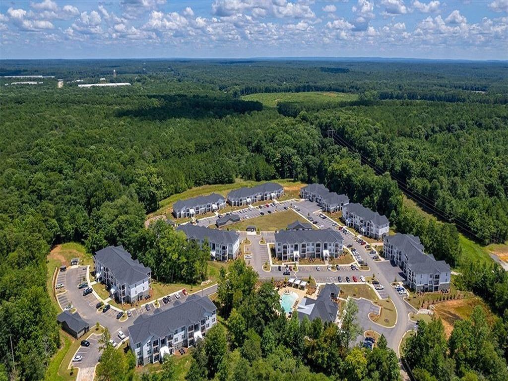 an aerial view of a resort with buildings and trees