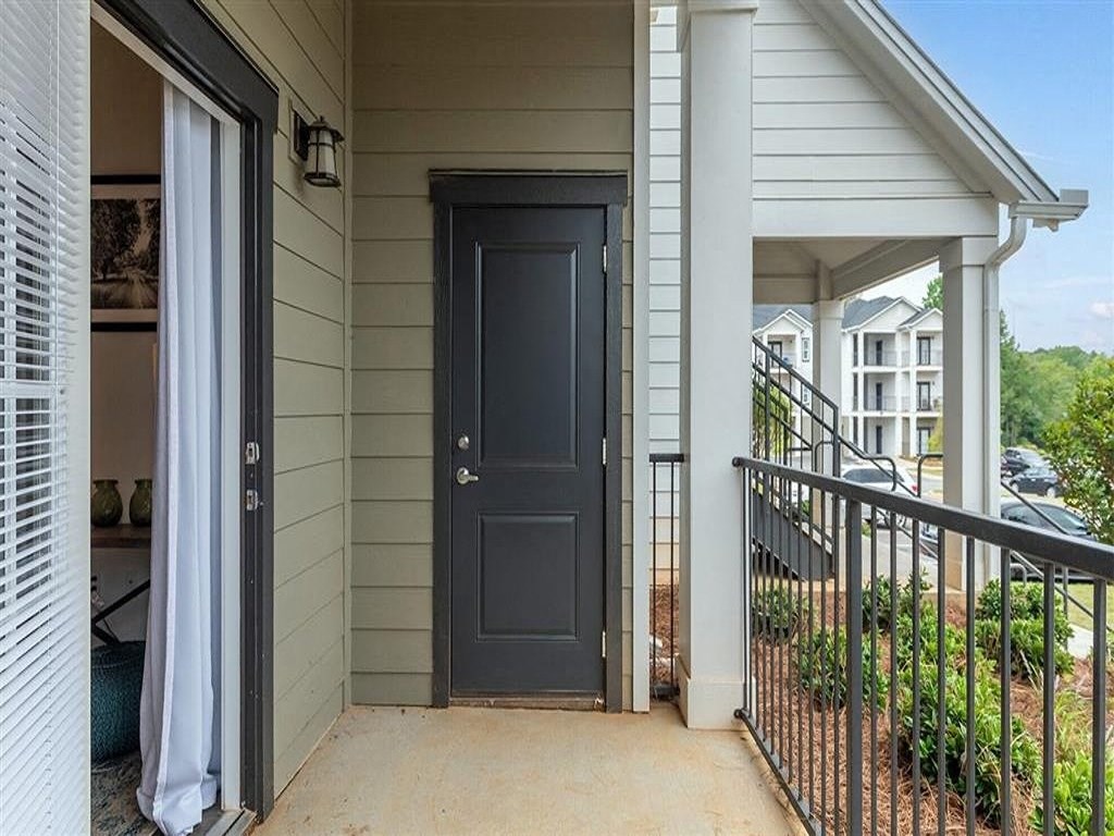 the front door of a house with a porch