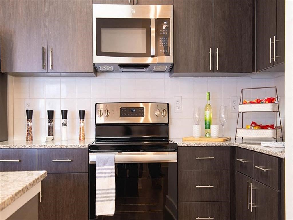 a kitchen with a stove and a microwave