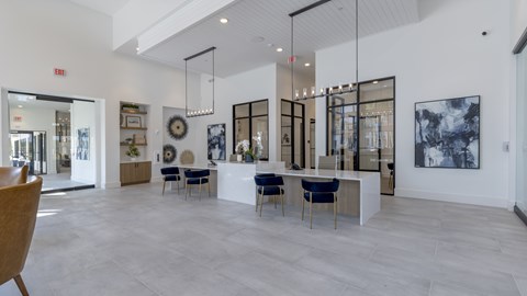 A spacious interior with a reception desk and chairs.