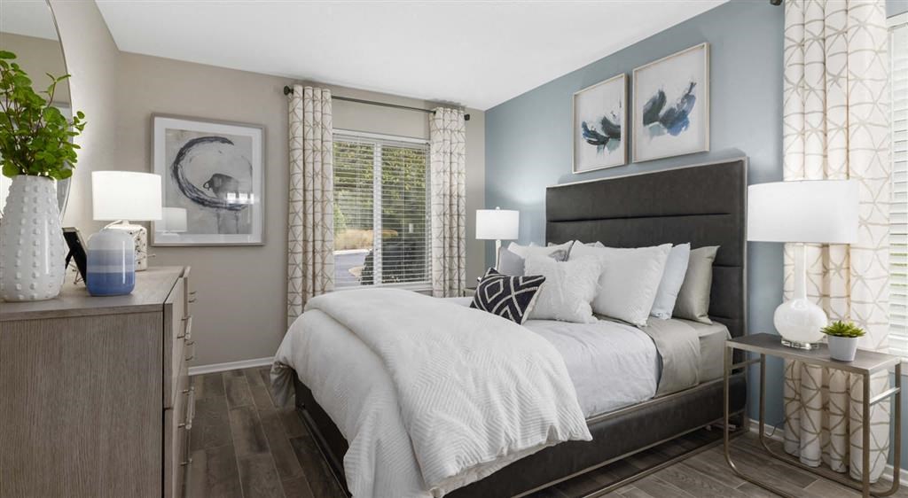 a bedroom with a large bed and a window