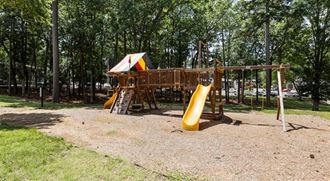 a playground with slides and a swing set