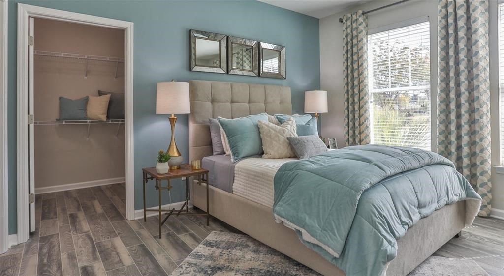 a bedroom with a bed and a closet