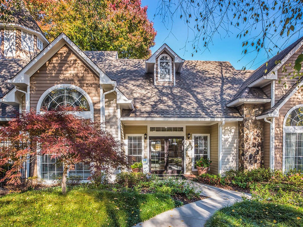 the front of a house with a pathway to the front door