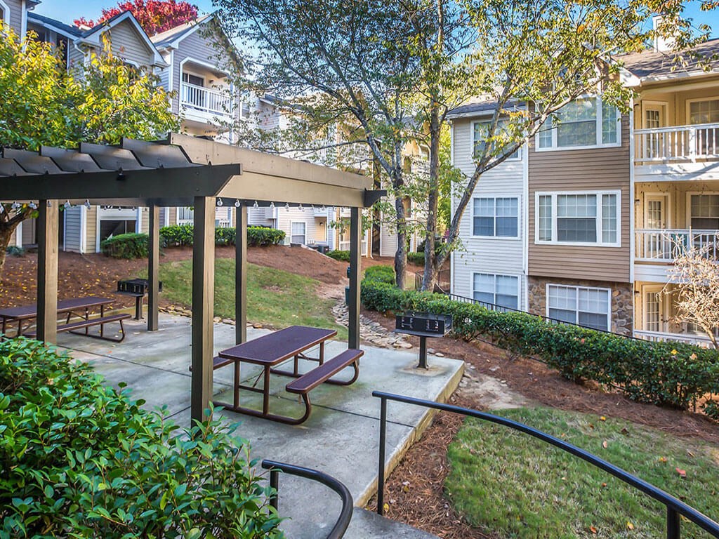 our apartments have a patio with benches and a gazebo