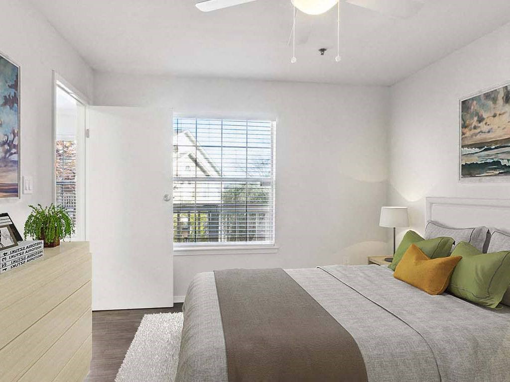 a bedroom with a bed and a window