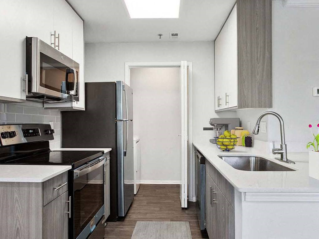 a kitchen with a sink and a refrigerator