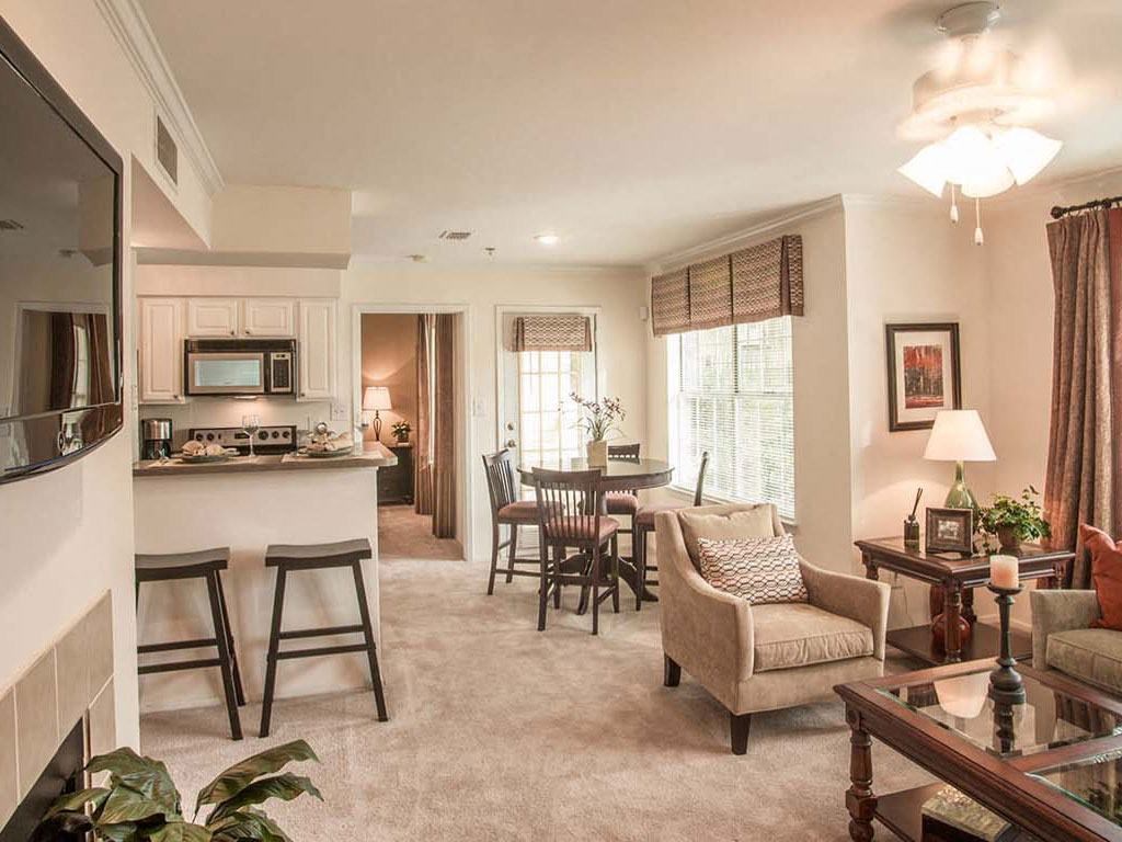 a living room with a kitchen and a dining room