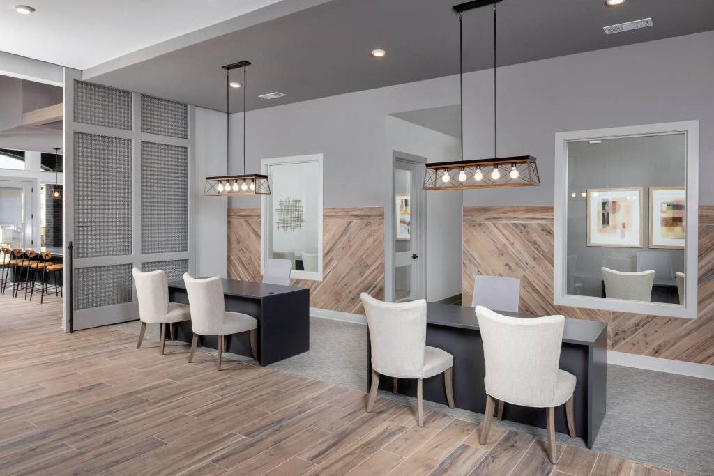 a dining room with a table and chairs