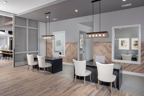a dining room with a table and chairs