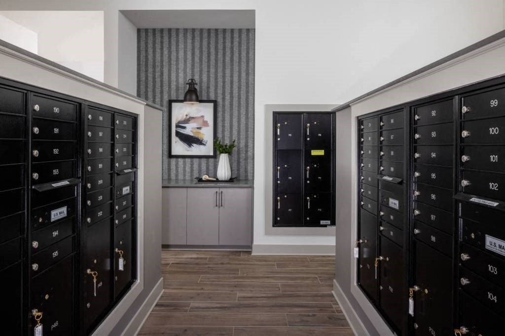 a walk in closet with a bunch of lockers
