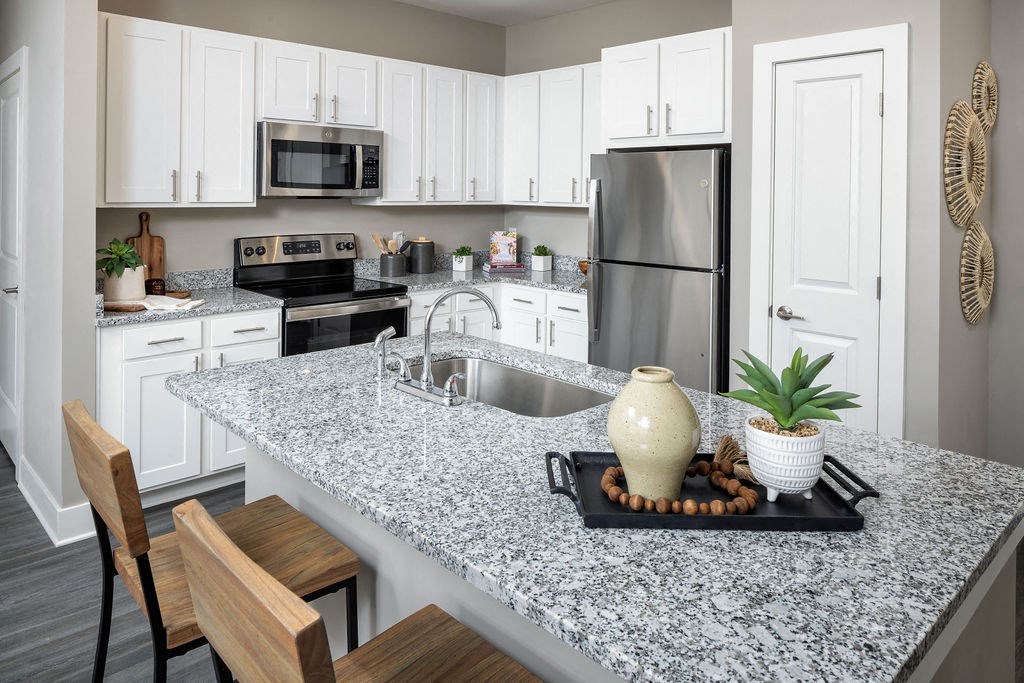 a kitchen with a granite counter top and a sink