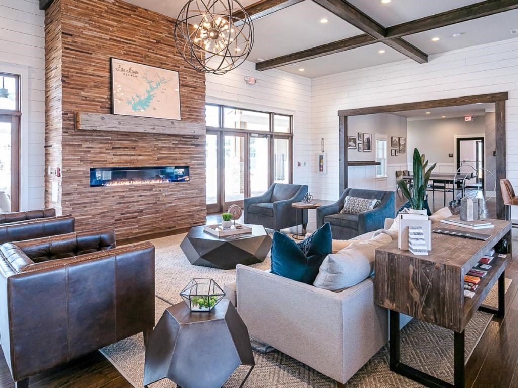 a living room with couches and chairs and a fireplace