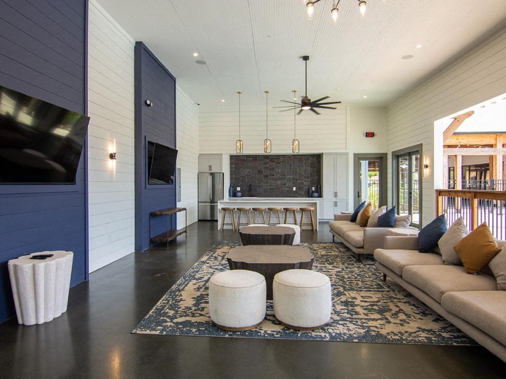 a large living room with couches and a table