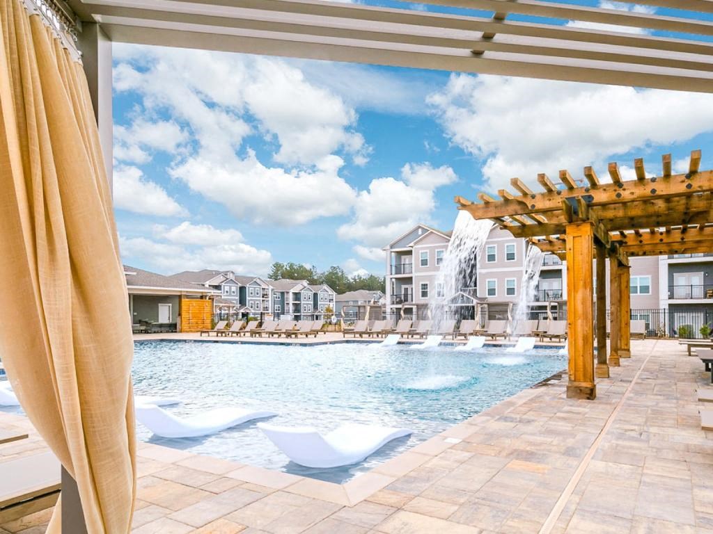 the swimming pool at the estates apartments