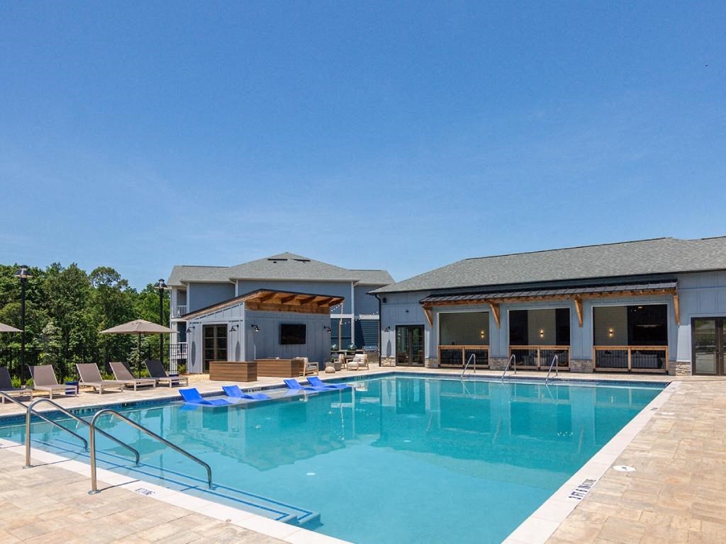 a swimming pool in front of a building