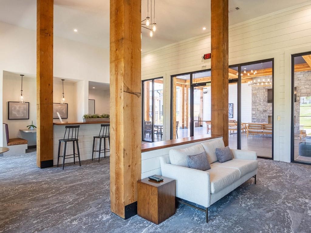 a living room with a couch and a bar in a house
