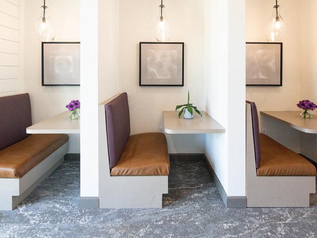 a small dining room with chairs and a table