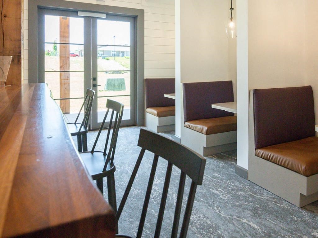 a dining room and living room with a table and chairs