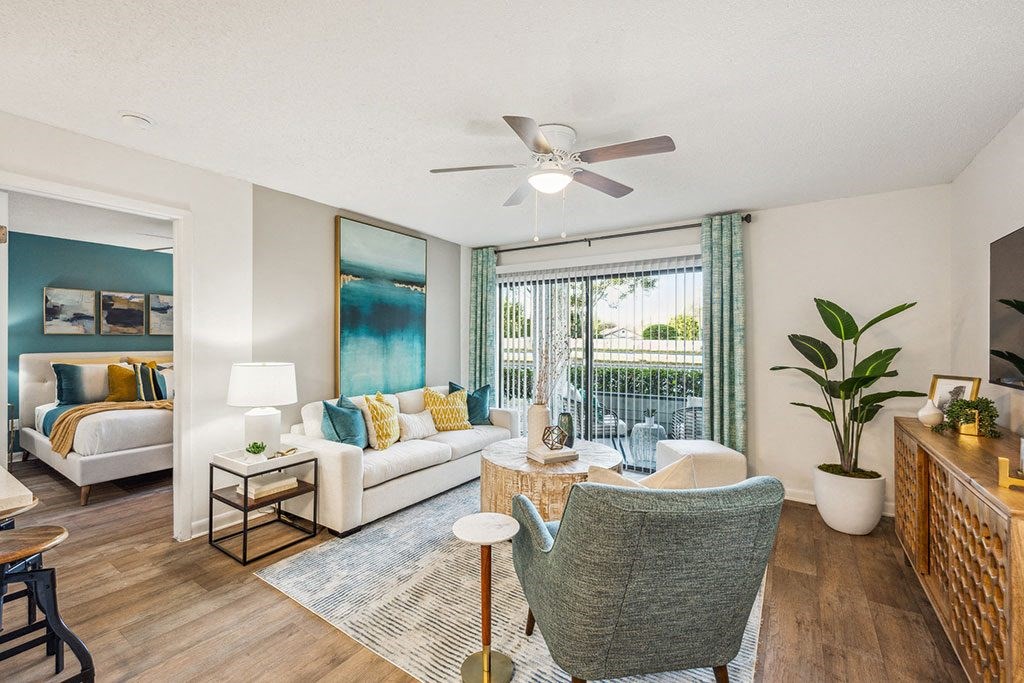 a living room with a staircase with a geometric design on the wall