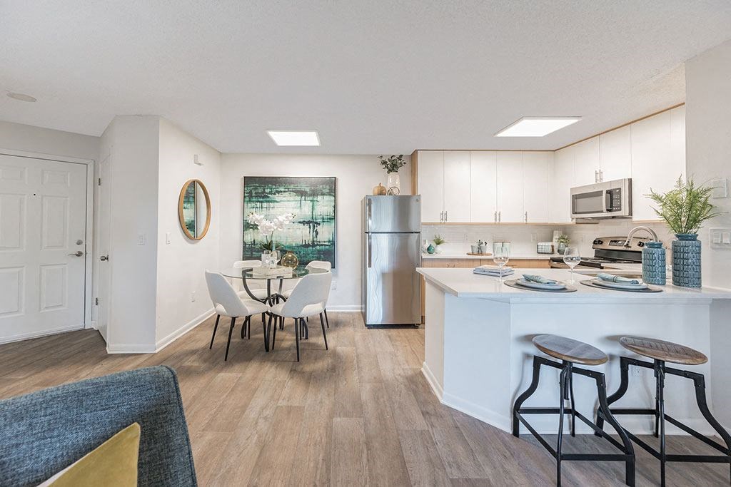 an open kitchen and dining room with a table and chairs