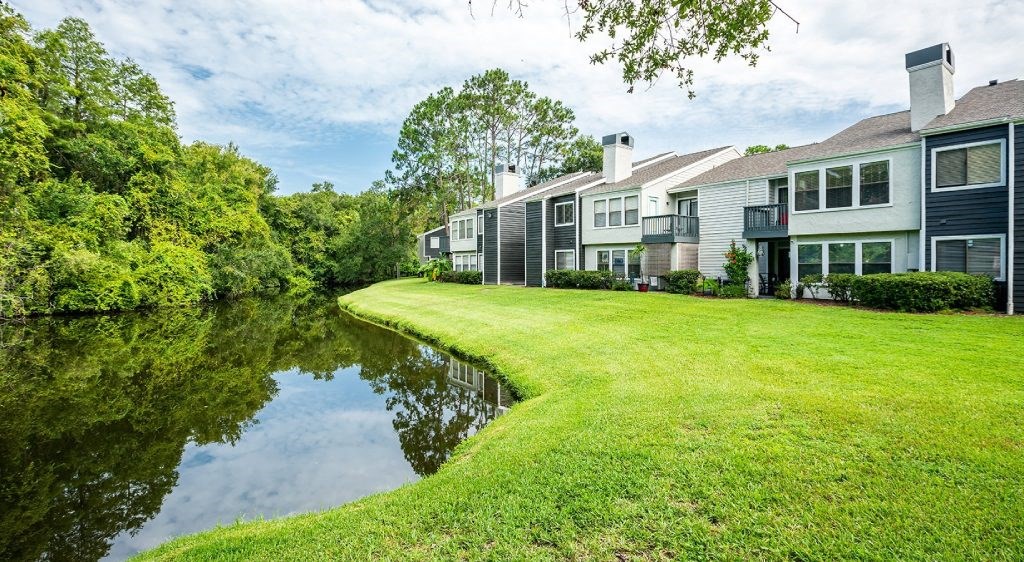 a screenshot of a video game with a plane flying over a field