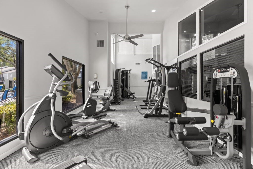 the gym is equipped with state of the art equipment including treadmills and weights