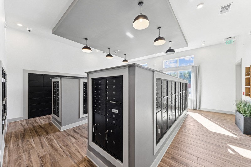 the tasting room has a large array of wine racks and a wood floor