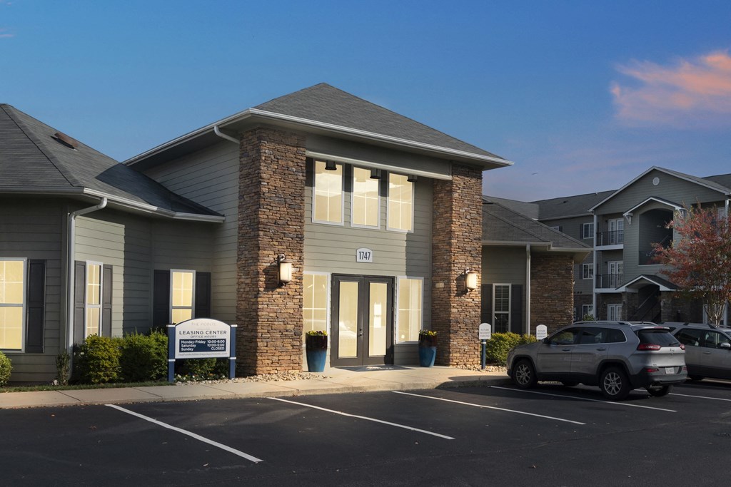 A building with a sign that says "Parking" in front of it.