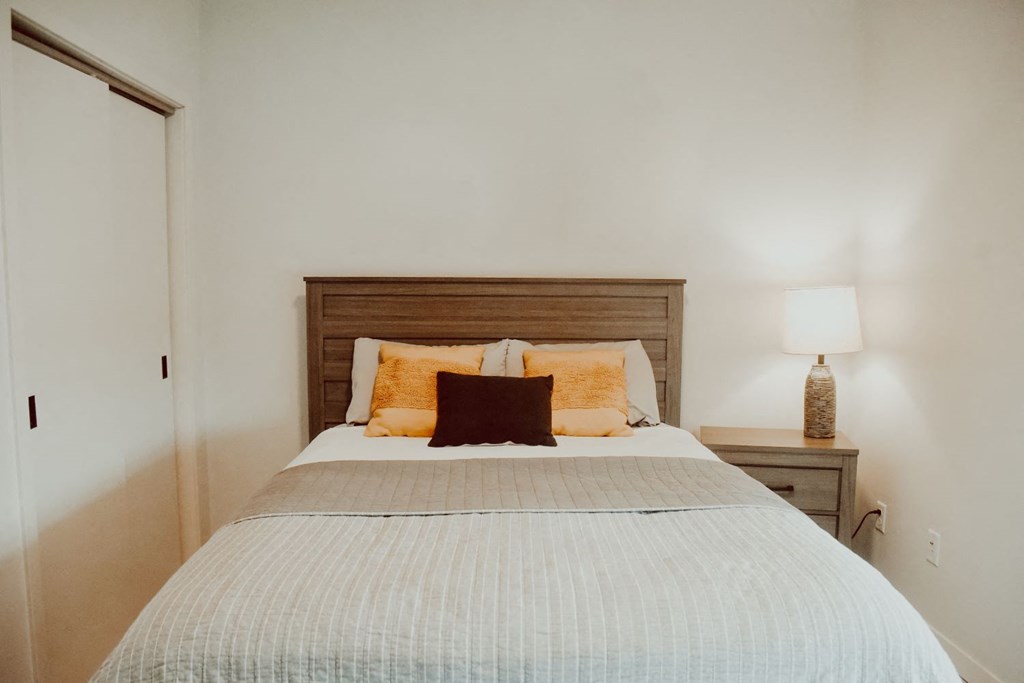 a bedroom with a bed and a door