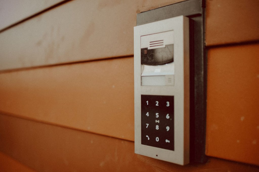 an intercom system on the side of a wall