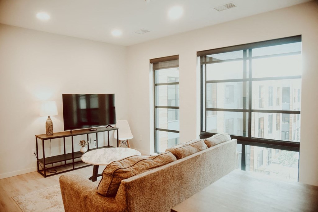 a living room with a couch and a television
