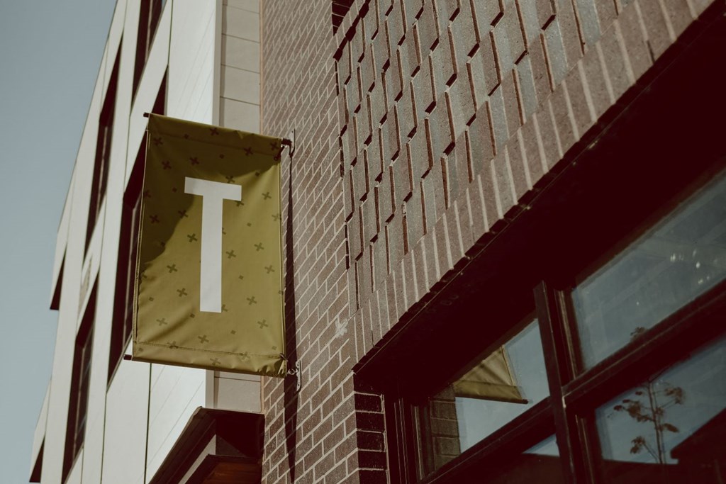 a sign on the side of a brick building