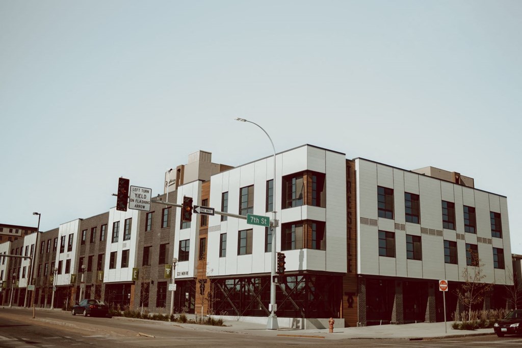 a group of buildings on the corner of a street