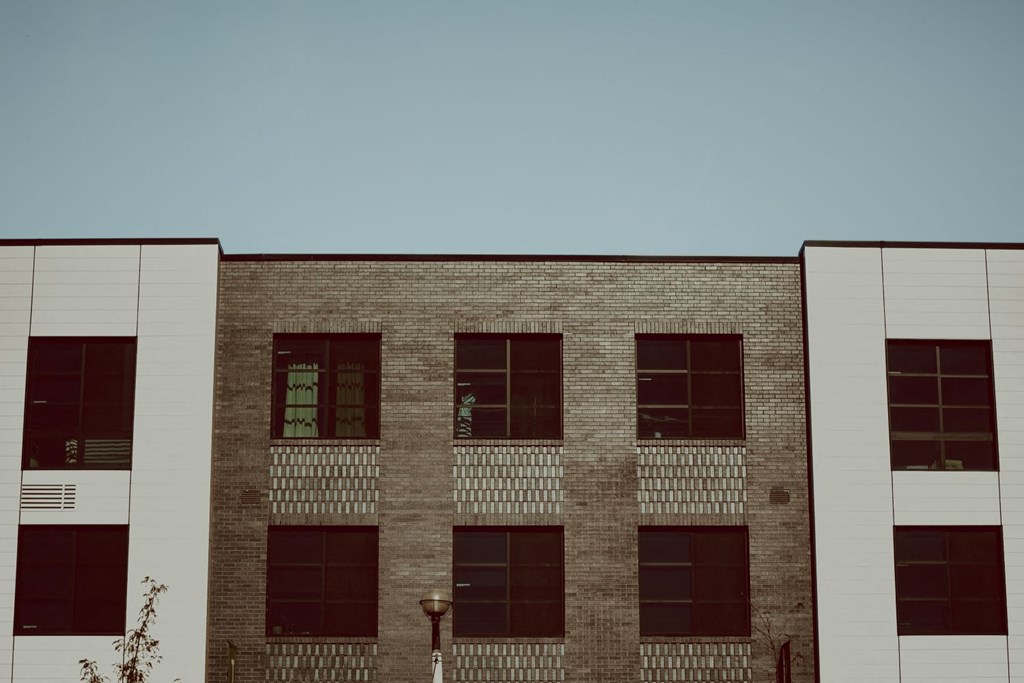 the side of a brick building with windows
