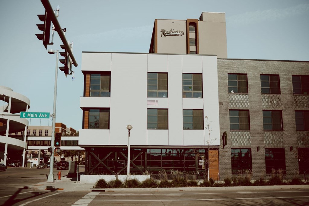 a white building with a street light in front of it