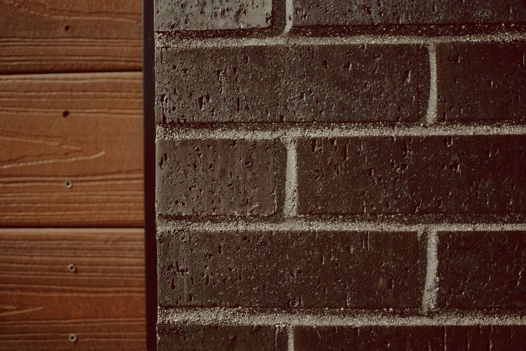 a brick wall and a wooden floor