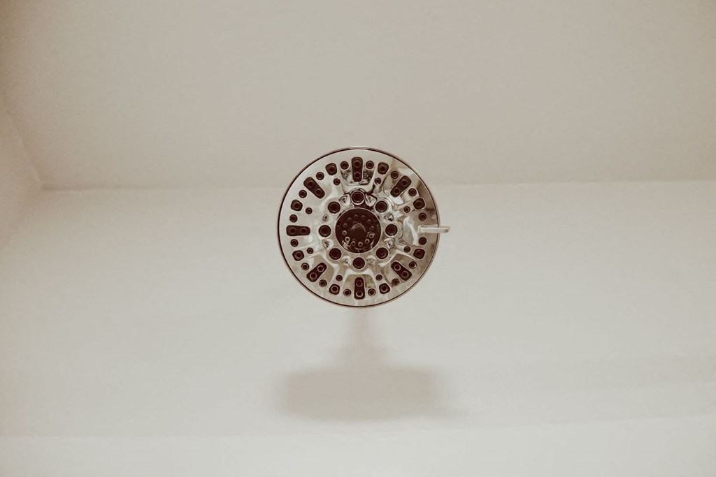 a shower head in a bathroom