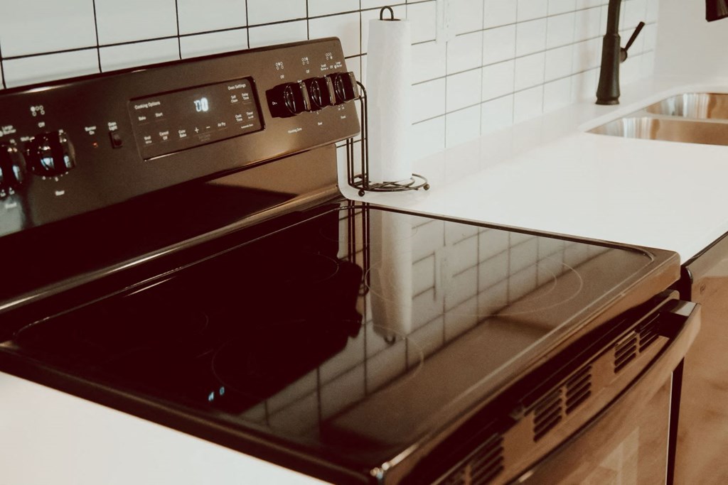 a stove top oven sitting on top of a kitchen counter